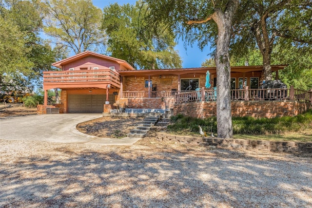 view of front of house with a garage and a porch