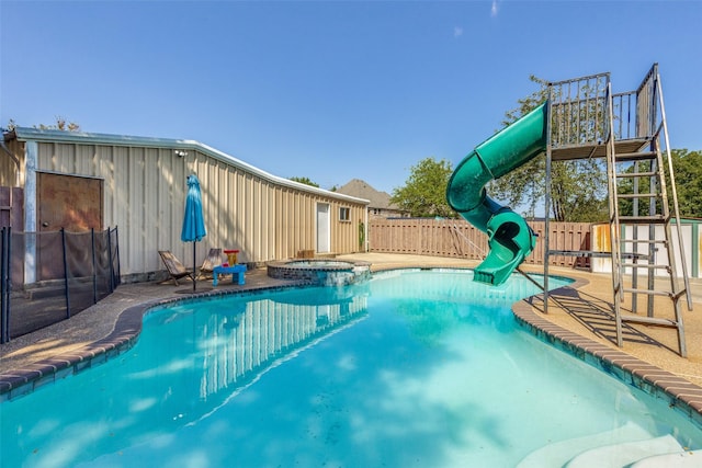 view of pool featuring an in ground hot tub and a patio area