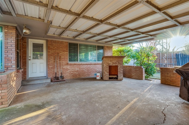 view of patio with a fireplace