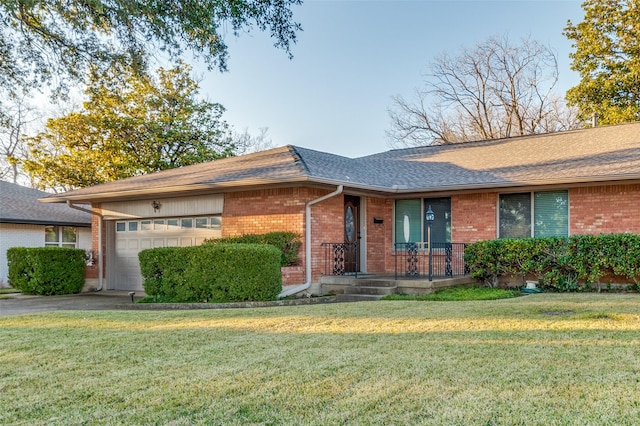 ranch-style house with a garage and a front lawn