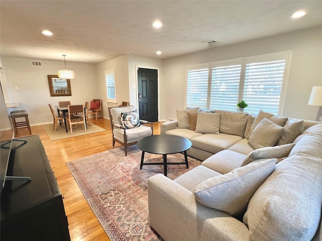 living room with light hardwood / wood-style flooring