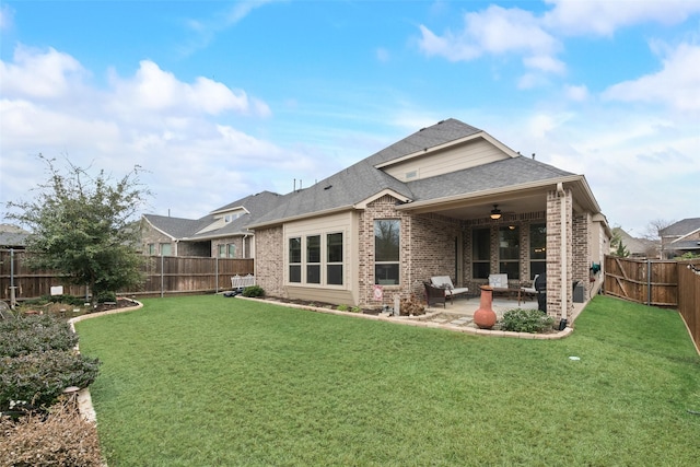 back of house with ceiling fan, a yard, and a patio