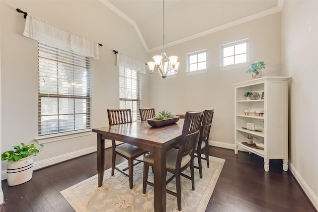 dining space featuring vaulted ceiling, crown molding, dark hardwood / wood-style floors, and a notable chandelier