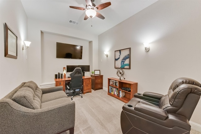 carpeted home office with ceiling fan