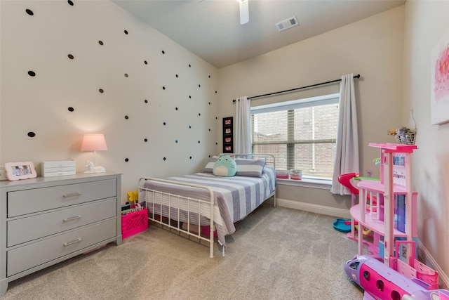 bedroom featuring light carpet and ceiling fan