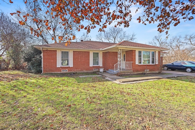 ranch-style home featuring a front yard