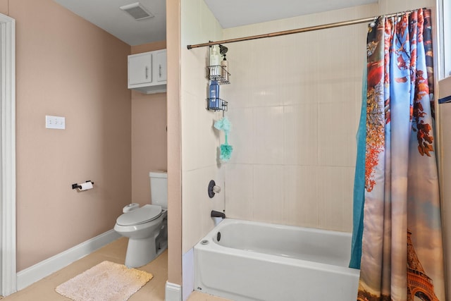 bathroom featuring toilet, shower / tub combo, and tile patterned flooring