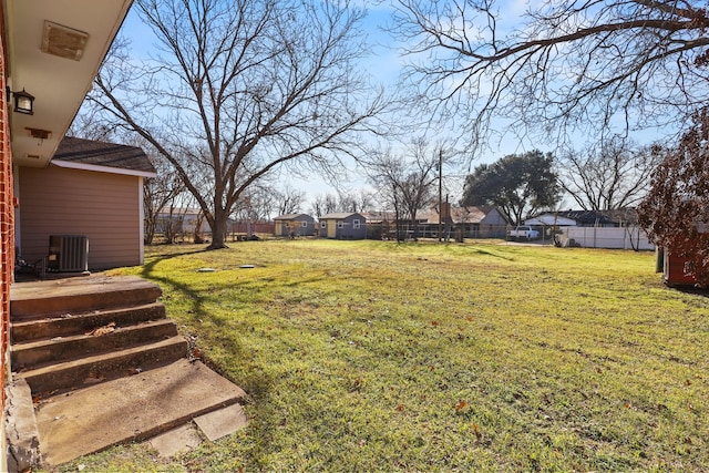 view of yard with central AC