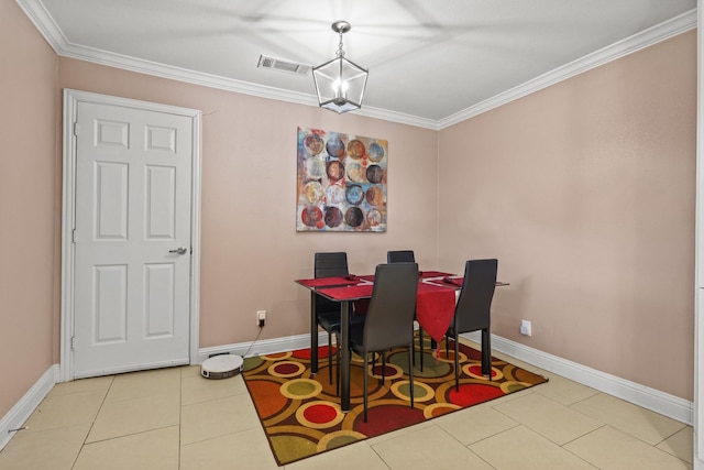 dining space with light tile patterned floors and ornamental molding