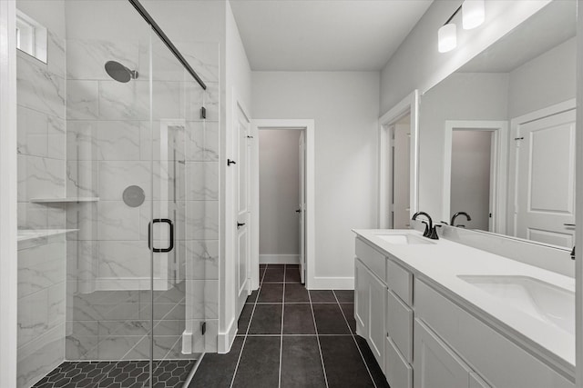 bathroom featuring vanity, tile patterned flooring, and a shower with door