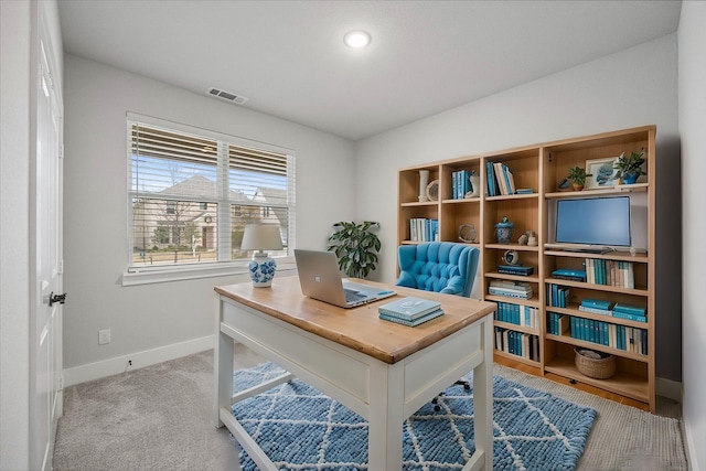 office space with light colored carpet