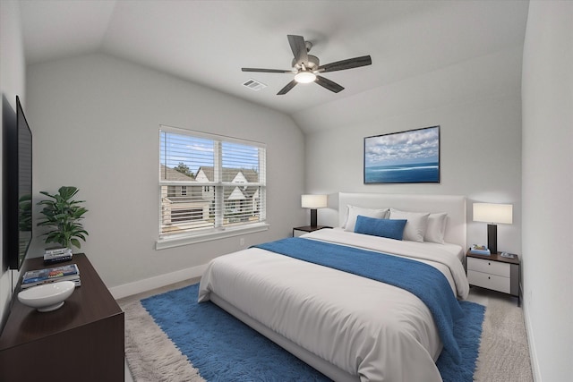 carpeted bedroom featuring vaulted ceiling and ceiling fan