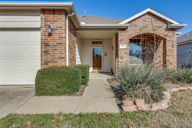 doorway to property featuring a garage