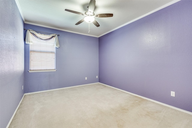 empty room featuring carpet floors, baseboards, ornamental molding, and ceiling fan