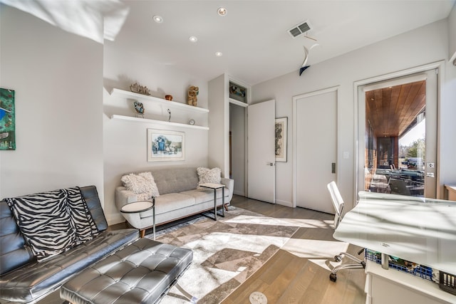 living room with light hardwood / wood-style floors