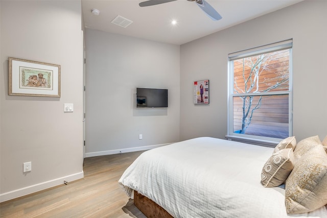 bedroom featuring ceiling fan and light hardwood / wood-style floors