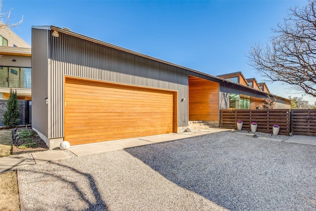 exterior space featuring an outbuilding and a garage