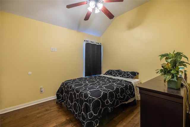 bedroom with ceiling fan, lofted ceiling, and dark hardwood / wood-style floors