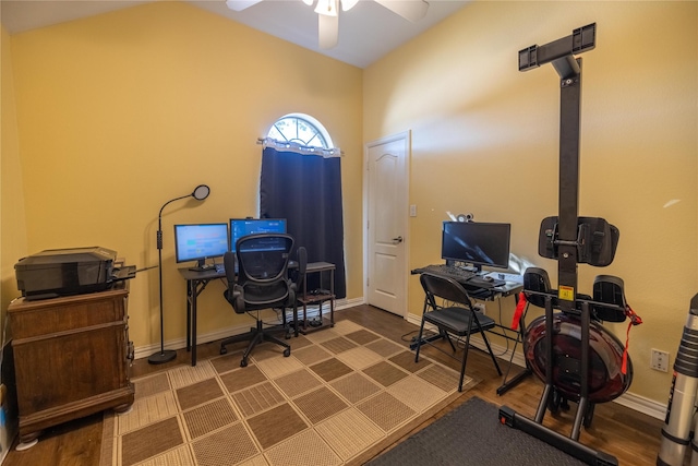 office area with ceiling fan, dark hardwood / wood-style flooring, and lofted ceiling