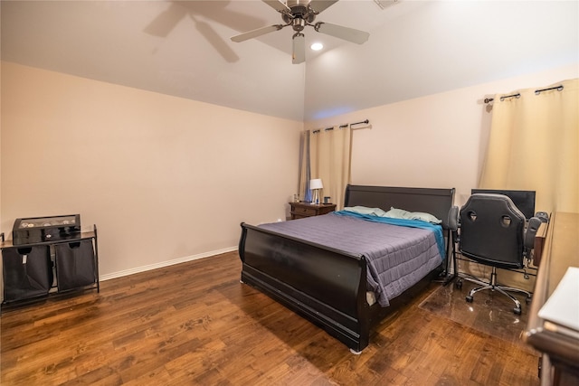 bedroom with ceiling fan, dark wood-type flooring, and high vaulted ceiling