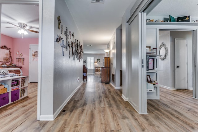 hallway featuring light hardwood / wood-style flooring