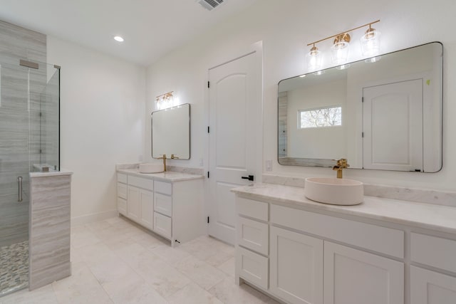 bathroom with walk in shower and vanity