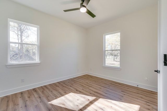 spare room featuring ceiling fan and light wood-type flooring