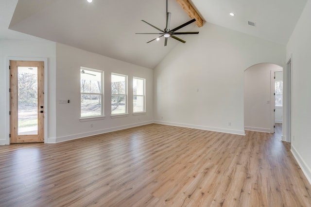 unfurnished living room with beam ceiling, ceiling fan, high vaulted ceiling, and light hardwood / wood-style floors