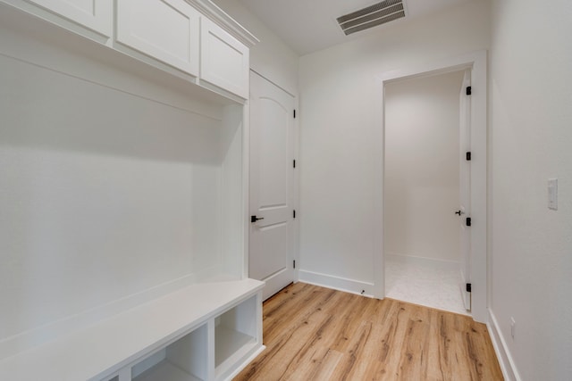 mudroom with light hardwood / wood-style flooring