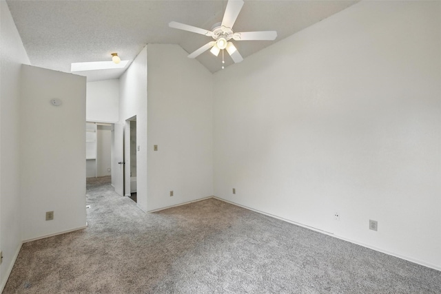 821 Dublin Dr Unit 203, Richardson, TX 75080 - carpeted empty room featuring a ceiling fan, vaulted ceiling, and baseboards