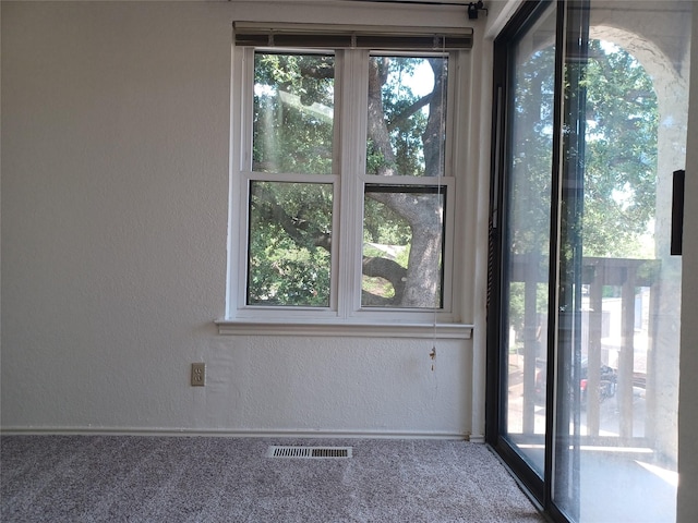 unfurnished room with carpet flooring