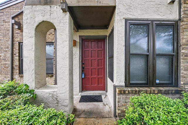 821 Dublin Dr Unit 203, Richardson, TX 75080 - view of exterior entry with stucco siding