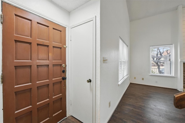 821 Dublin Dr Unit 203, Richardson, TX 75080 - entrance foyer with baseboards and dark wood-type flooring