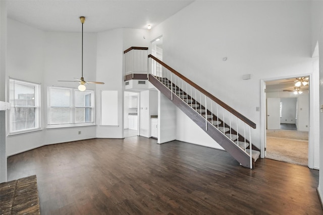 821 Dublin Dr Unit 203, Richardson, TX 75080 - unfurnished living room featuring a towering ceiling, a ceiling fan, and stairs