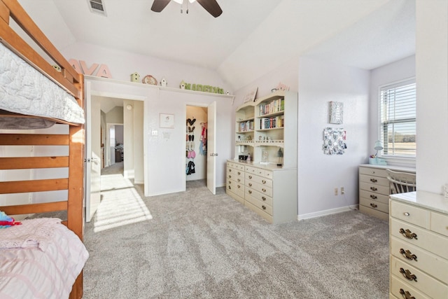 carpeted bedroom featuring ceiling fan and vaulted ceiling