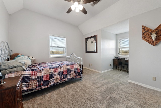 bedroom with ceiling fan, vaulted ceiling, and carpet floors