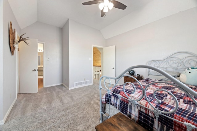 carpeted bedroom with ceiling fan and vaulted ceiling