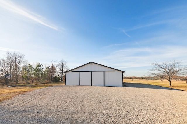 view of outbuilding featuring a rural view