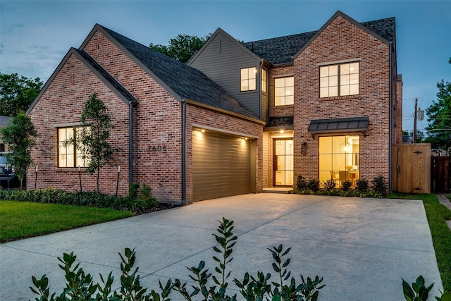 view of front of house with a front yard and a garage