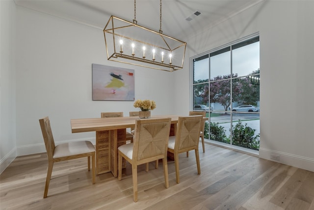 dining area featuring plenty of natural light and wood-type flooring