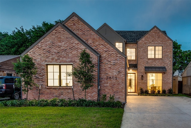 view of front of home with a lawn