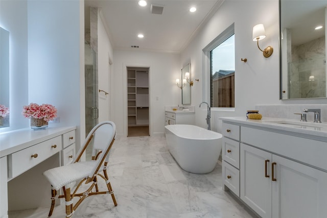 bathroom featuring vanity and separate shower and tub