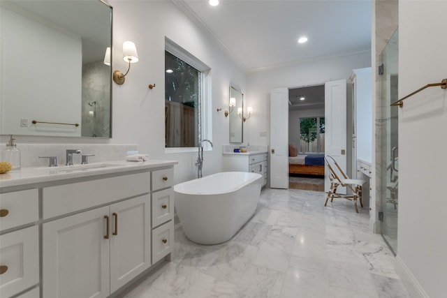 bathroom featuring vanity, ornamental molding, and separate shower and tub