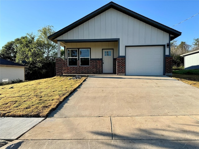 view of front of property featuring a garage and a porch