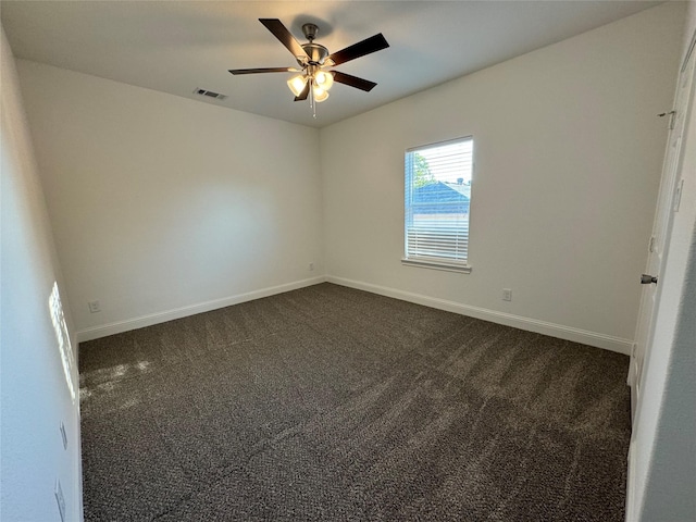 carpeted empty room featuring ceiling fan