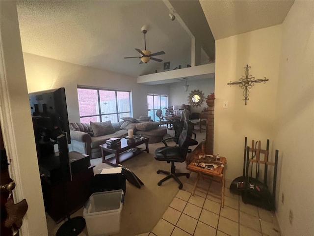 office with ceiling fan, light tile patterned flooring, a textured ceiling, and high vaulted ceiling