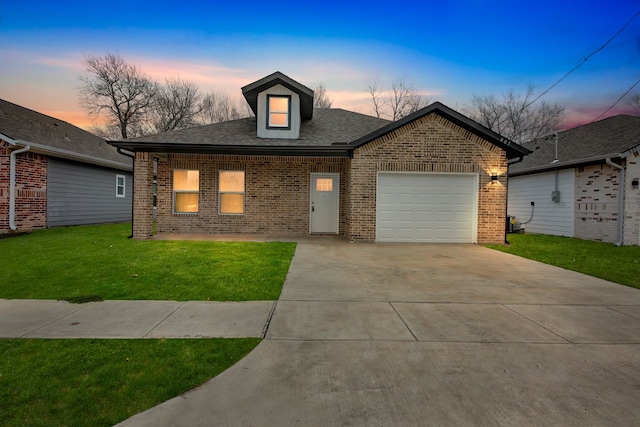 view of front of house with a lawn and a garage