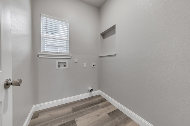 laundry area with washer hookup, light hardwood / wood-style flooring, hookup for an electric dryer, and gas dryer hookup