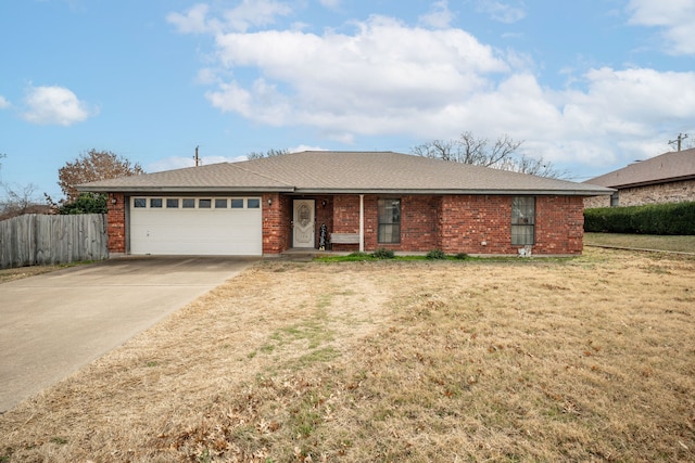 ranch-style house featuring a front lawn and a garage