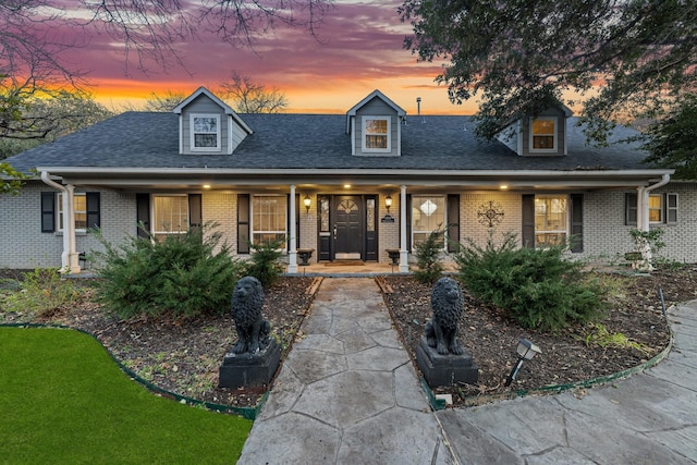 cape cod home with a porch